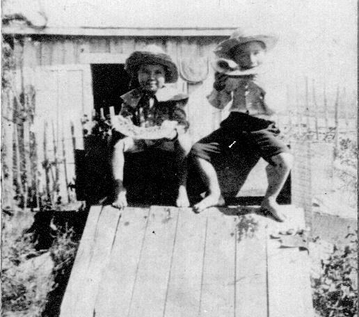 Cecil sitting on the Cellar Door eating watermelon